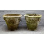 A pair of large reconstituted stone tapering conical planters with swag decoration,
