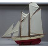 'Osprey', a schooner rigged yacht, built circa 1920, restored, 2010, on a wooden stand, 115cm high.