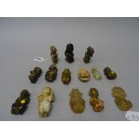 A group of twelve jade and two rock crystal figures, various colours,