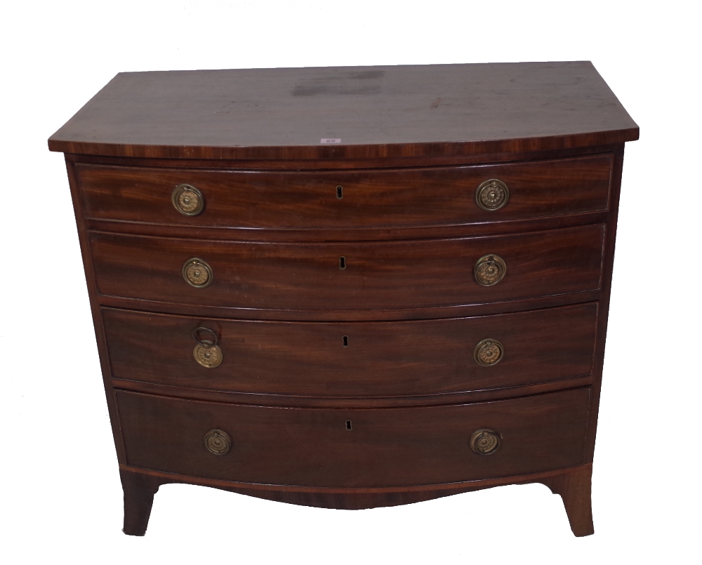 A George III mahogany bowfront chest, of four long graduated drawers on splayed bracket feet,