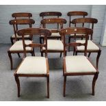 A set of eight late Regency mahogany dining chairs, with tablet twist rail and sabre supports,