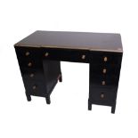 Morris & Co, Glasgow; an early 20th century ebonised and brass mounted breakfront kneehole desk,