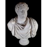 After the Antique; a modern resin bust depicting a man in Roman clothing, on turned socle,