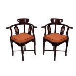 A set of four early 20th century Chinese hardwood tub back armchairs, pre-1918,