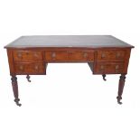 A George III mahogany kneehole desk, with five drawers on spiral twisted tapering suports,