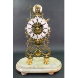 A Victorian brass skeleton clock, of ope