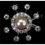 A cultured pearl and diamond star brooch