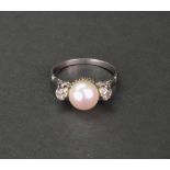 A white gold, cultured pearl and diamond