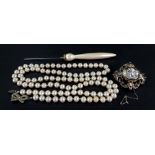 An imitation pearl long handled hat pin,