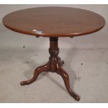 A George III mahogany tripod table, the birdcage mount over three downswept supports,