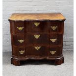 A late 18th German walnut commode of three serpentine drawers, on bracket feet,