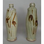 Clare Sutcliffe (1943-2019), a pair of tall vases, iron brush work with celadon glaze, wood fired,