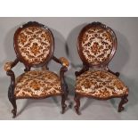 A Victorian walnut framed gentleman's open armchair,