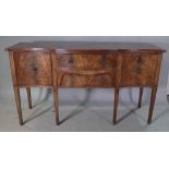 A George III style mahogany serpentine sideboard on square tapering supports 168cm wide x 93cm high.