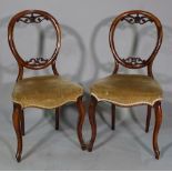 A set of eight Victorian mahogany balloon back dining chairs, (8).