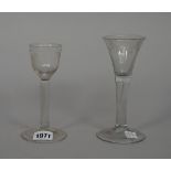 An engraved wine glass, mid 18th century, the ogee bowl engraved with a bird and grapes,