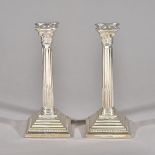 A pair of silver Corinthian column candlesticks,