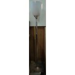 A 20th century chrome floor standing lamp, with white opaque plastic shade on plinth base,
