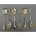 A pair of Victorian silver Hanoverian, thread, shell and quilt pattern berry spoons,