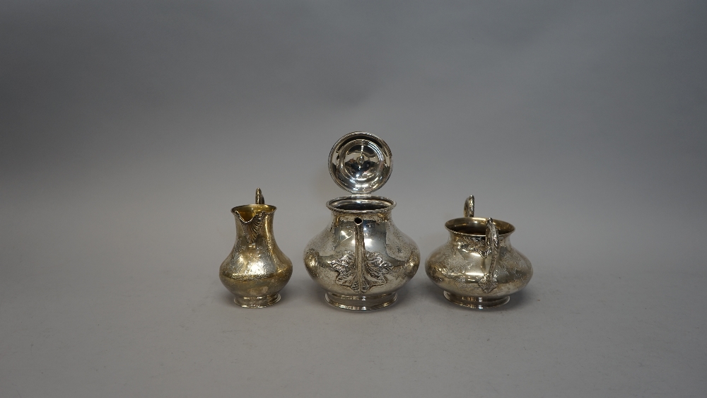 A Victorian silver three piece tea set, comprising; teapot, sugar bowl and milk jug, - Image 4 of 5