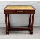 A 20th Century mahogany writing table in the Empire style, leather inset top above fitted drawer,