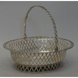 A George V silver swing handled fruit basket,