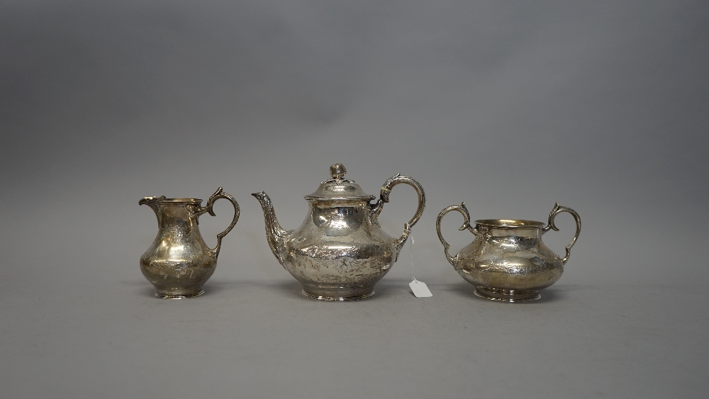 A Victorian silver three piece tea set, comprising; teapot, sugar bowl and milk jug, - Image 3 of 5