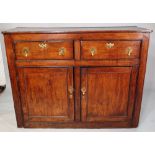 A 19th century oak dresser base with two drawers over cupboard base, 136cm wide x 104cm high.