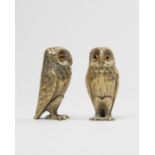 Tiffany & Co; a pair of silver gilt novelty cruets modelled as owls, London 1959, glass set eyes,