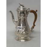 An early George III silver coffee pot of baluster form,