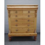 A large Scottish pine chest with cushion drawer over two short and four long drawers on turned feet,
