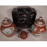 A 20th century Chinese black lacquer table top collector's chest with mother of pearl inlaid