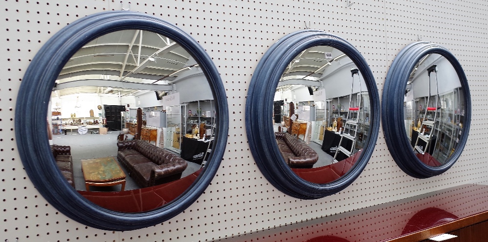 A set of three 20th century convex wall mirrors in blue painted moulded frames, 64cm diameter. - Image 2 of 5