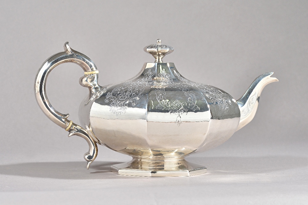 A Victorian silver teapot, of squat octagonal form,