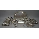 A group of plated wares, comprising; a three piece tea set with a shaped oval twin handled tray,