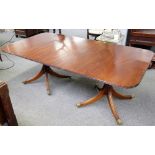 A Regency style mahogany "D" end dining table on eight downswept supports, one extra leaf,