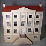 A 20th century Georgian style four storey doll's house 105cm wide x 111cm high.