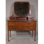 An Edwardian inlaid dressing table, with swing mirror, 108cm wide.