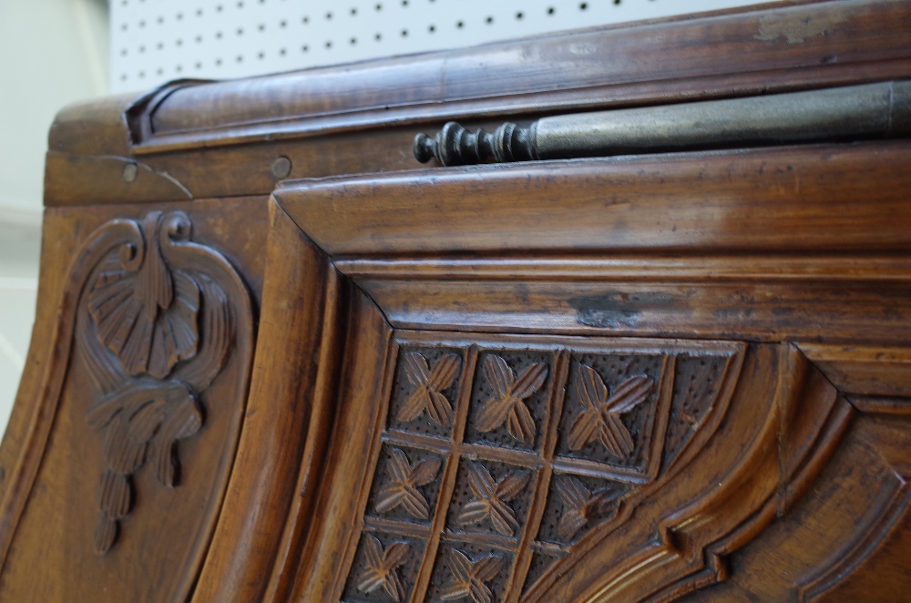 An 18th century fruitwood armoire with carved arched cornice over a pair of shaped panel doors, - Image 5 of 7