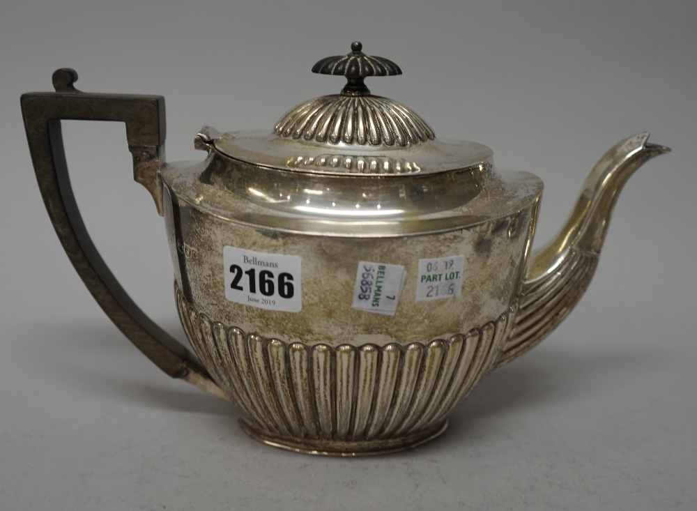 A silver composite four piece tea set, comprising; an oval teapot, with black composition fittings, - Image 3 of 6