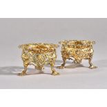 An unusual near pair of Victorian silver gilt salt stands in the Chinese Chippendale manner,