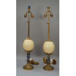 A near pair of brass and Lapis mounted table lamps with ostrich egg mount to the stem over a fluted