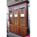 A 19th century French mahogany side cabinet, with three glazed doors, over cupboards,