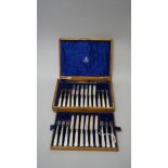 A 24 piece cased set of silver and mother of pearl handled fruit knives and forks,