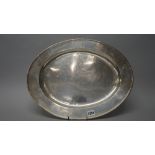 A George V silver meat dish of oval form, Charles and Richard Comyns, London,
