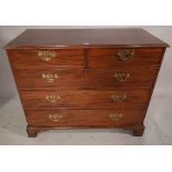 A George III mahogany chest of two short and three long drawers on bracket feet,
