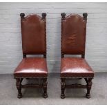 A pair of 19th century Continental oak leather upholstered side chairs on caryatid supports and