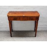 A George III mahogany card table, the 'D' shape top on turned supports, 92cm wide x 74cm high.