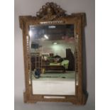 A 19th century French gilt framed mirror with cartouche crest and out stepped square corners,