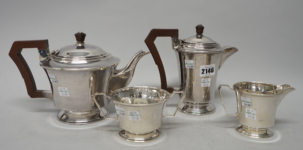 A silver four piece tea set, comprising; a teapot, a hot water jug,
